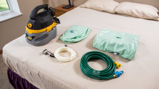 Includes vacuum, drainage hose, shower hose, inflatable mattress, and inflatable backrest