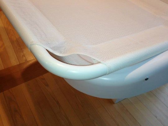 The Pressalit Care 2000 Adult Changing Table (R8478000-93) comes equipped with a mesh covering that may be easily removed.