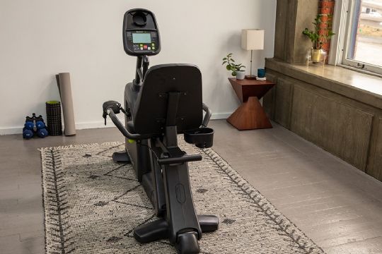 Users can simply step through the device, sit down, and begin their workout with ease