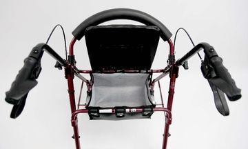 The padded seat of he Lightweight Rollator is curved to provide the user of the rollator comfort. 