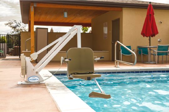 Range 2 Pool Lift shown with White Frame and Tan Seat