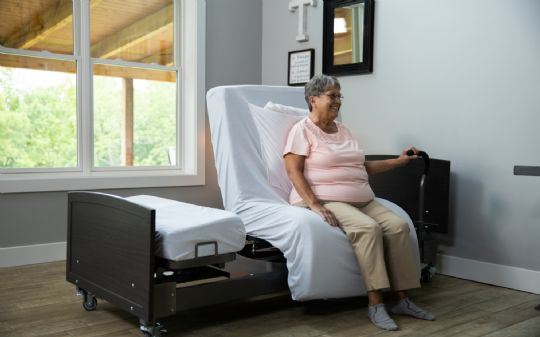 Fixed-Height ActiveCare Bed with upgraded casters and handle bar (the casters and handlebar are sold separately)