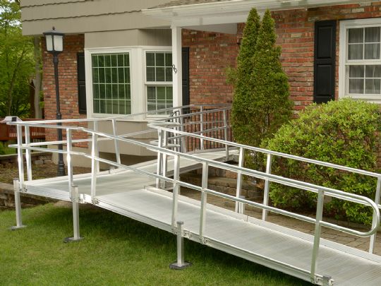 If your ramp is installed on grass or uneven terrain, your ramp's legs will be placed on Ground Discs (shown above).