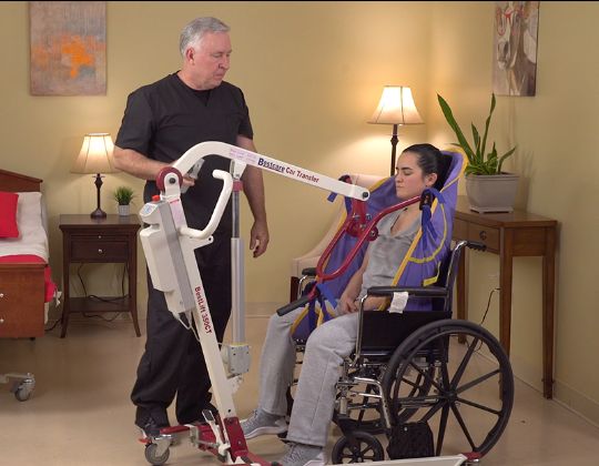 BestLift Patient Lift shown assisting a patient into a wheelchair