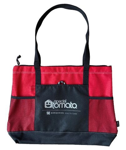 Travel tote features a large pocket to carry wipes, equipment, etc.