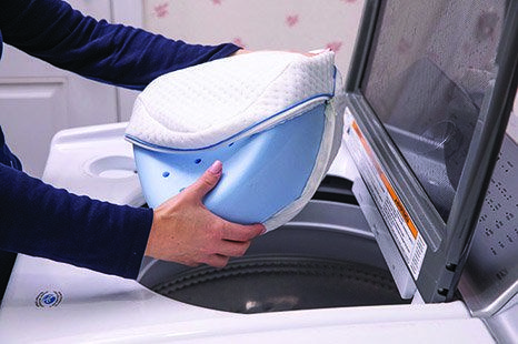 The pillow's cover can be removed and is machine washable