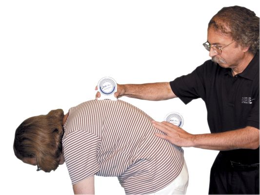Physician using the  Baseline Bubble Inclinometer  on a patient
