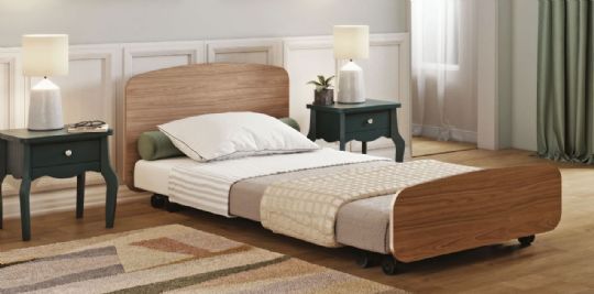 The Empresa Floor Bed is shown in a bedroom  Arc Cherry
