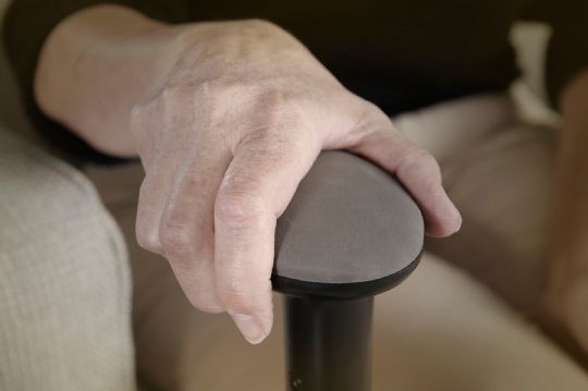 Support handle to assist with standing and sitting
