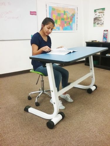 Kidsfit Kinesthetic Classroom Scooter Stool shown in use.
