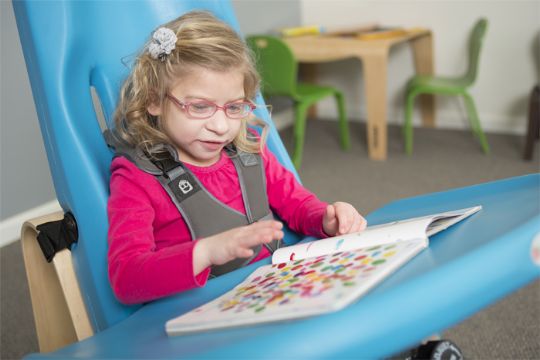The Mobile Activity Tray from Special Tomato allows children who use wheelchairs, walkers, or standers to have a convenient, adjustable, and mobile activity space for eating, working, or playing.