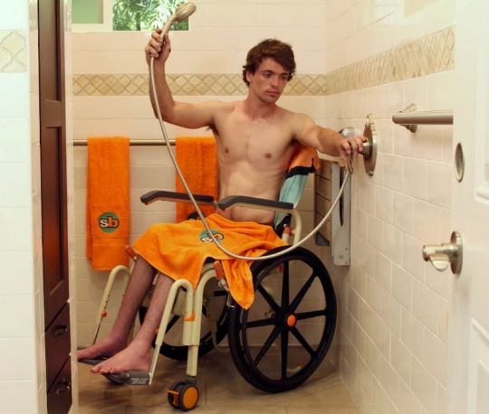 Roll-In Shower Buddy Solo Shower Commode Chair shown in use