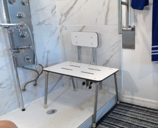 View of the transfer bench being used in a shower area