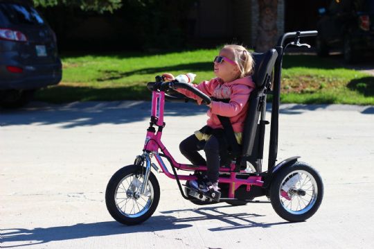 Another view of the Discovery Series DCP 12 Pediatric Trike in use