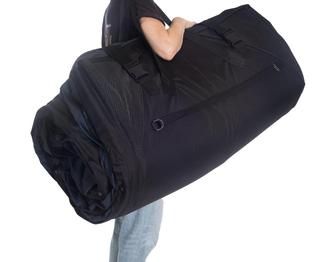The Pro Dynamic Mattress can be rolled up, secured by two straps, and transported or stored away easily.