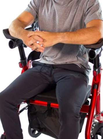 View of a person sitting on the padded seat and backrest