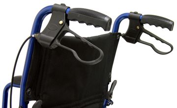 Close up view of the dual squeeze breaks for the transport wheelchair.