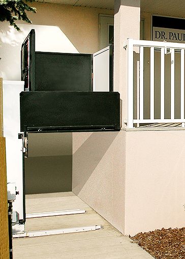 Butler RAM Lift used to enter a building with a small balcony