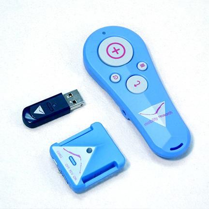 The included sensor, small hand clicker, and USB receiver. 