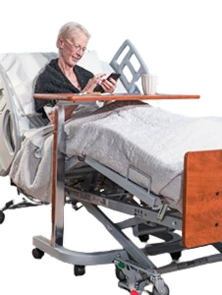 Picture shows the premium Adjustable Overbed Table in use