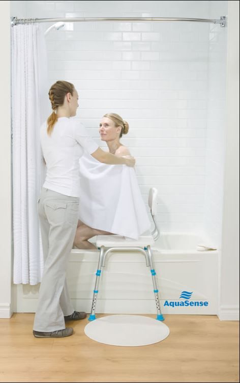 Person Using the AquaSense Bathtub Transfer Bench with Caregiver Assistance