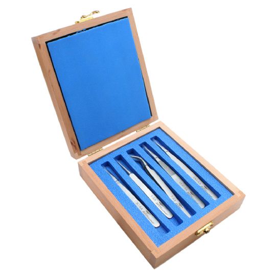 Elegant wooden case holding the Technik 5-Piece Stainless Steel Precision Tweezer Set