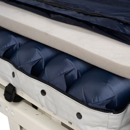 Close-up of the mattress showing foam and air cell layers