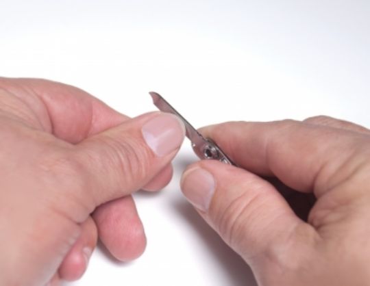 Fingernail Clipper features a nail filer