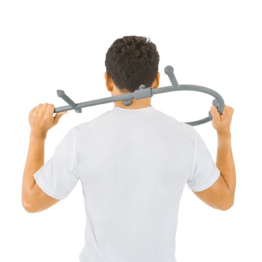 Man using an ergonomic massage cane to relieve shoulder tension