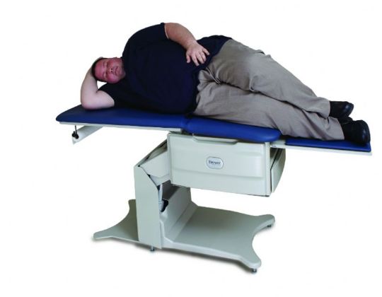 Side view of the Brewer FLEX Access Pneumatic Exam Table that will lay flat for easier examination.