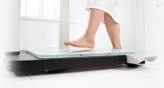 Safety glass weighing platform has a low profile design that makes it easy for the patient to step onto