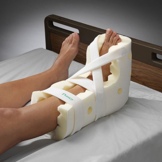 Each Posey Premium Heel Guard has a soft outer lining that allows for firm attachment of ankle and foot drop straps and reduces friction against bedsheets. 