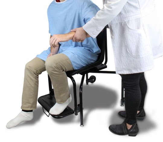 Professional helping patient out of chair