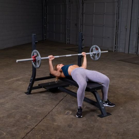 Bench press with medium weights (barbell and weights not included)