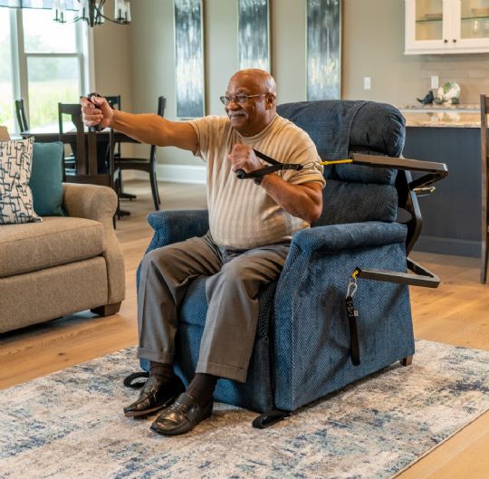 The SitFitGo has movable arms that can tuck away behind the chair when you have guests.