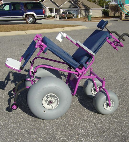 Shown with the upgraded tilt in space AND reclining feature. Also, it has the upgraded powder-coating in the color pink. 