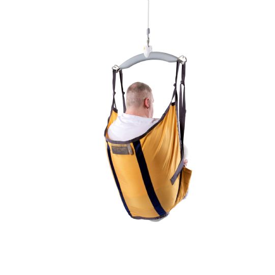 Individual seated in a guldmann amputee sling, providing secure full-body support for easy lifting