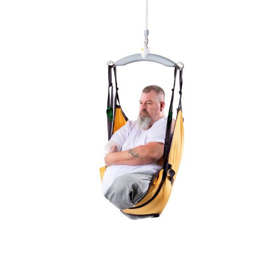 Man seated in a guldmann amputee sling, ensuring safe and comfortable lifting