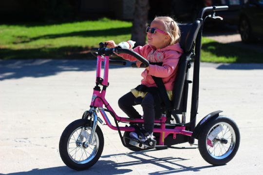 Discovery Series DCP Mini Pediatric Tricycle in Pink, Picture shows the tricycle in use
