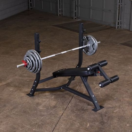 The decline bench showing with barbell and additional weights (barbell and weights not included)
