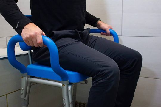 The Deluxe Bariatric Shower Chair in use