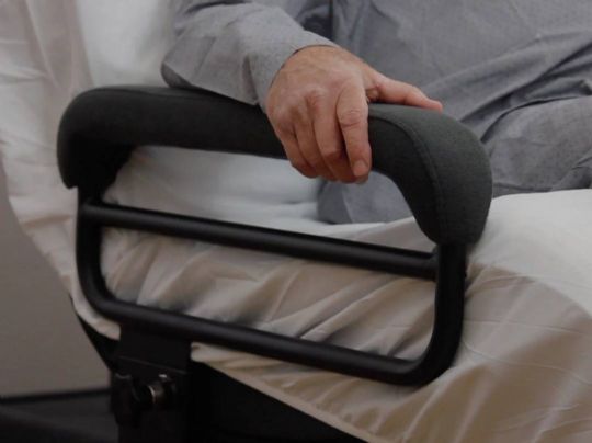 Built-in armrests offer stability to users when standing or repositioning in bed, and are padded for comfort and safety.