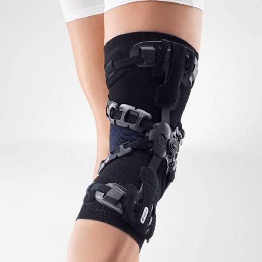 Genutrain oa knee brace providing targeted support with adjustable straps and stabilizing hinges