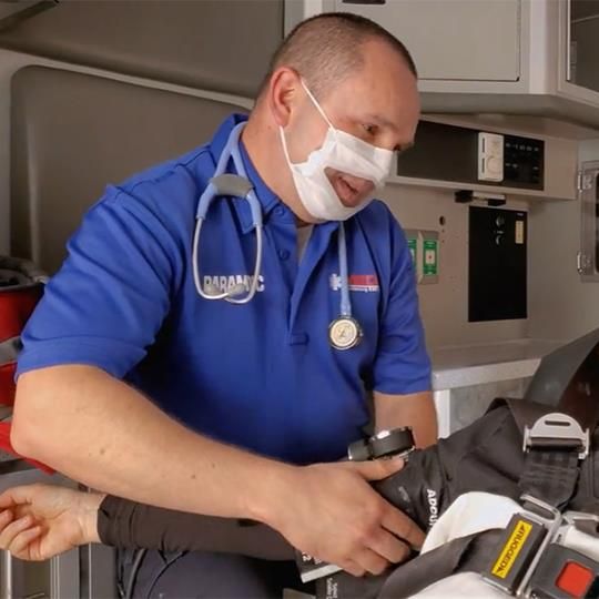 Paramedic wearing a Safe N Clear surgical mask