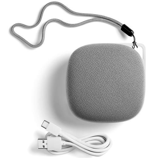 Yogasleep Travelcube white noise machine with USB charging cable and removable lanyard for portability