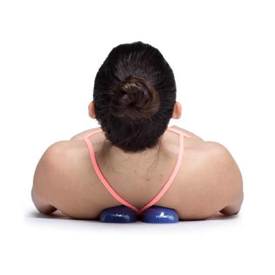 Using no-roll half balls for back massage and muscle tension relief