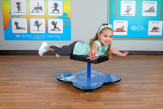 Child using the Helicopter Spin Trainer to improve balance and coordination