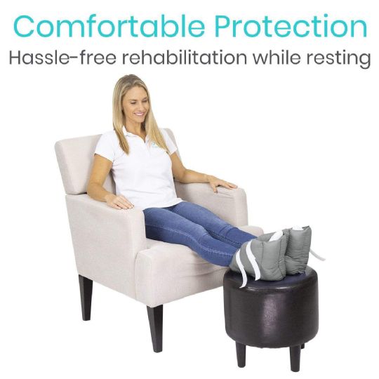 Woman resting comfortably with cushioned heel pillows for foot protection