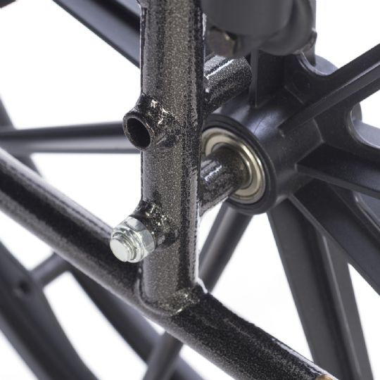 Close-up of wheelchair frame with precision-sealed wheel bearings.