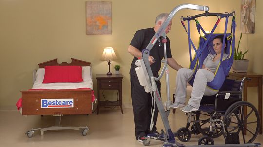 Wheelchair to bed transfers are made easy with the PL500 lift